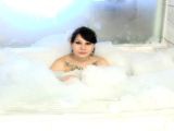 Sweet brunette exgirlfriend Jennique showing her hot tattoos and big jugs in bubble bath